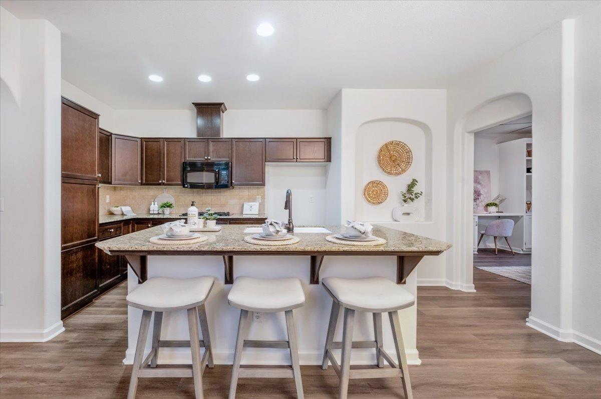 3755 Richmond Avenue Clovis, CA 93619 - Photo 7 of 30 a kitchen with a sink and chairs