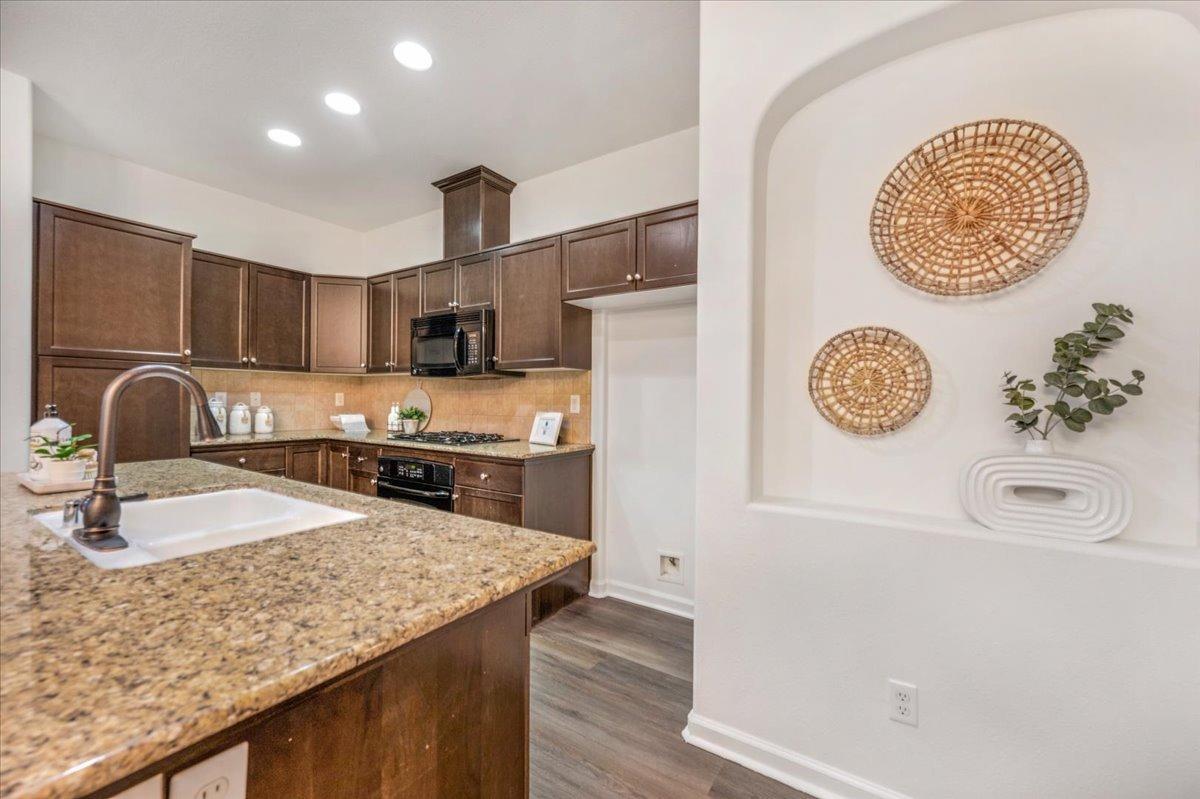 3755 Richmond Avenue Clovis, CA 93619 - Photo 9 of 30 a kitchen with a sink a stove and cabinets