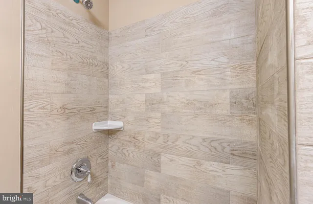 a kitchen with granite countertop stainless steel appliances a sink cabinets and a window