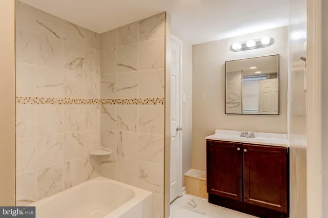 a white toilet sitting next to a shower