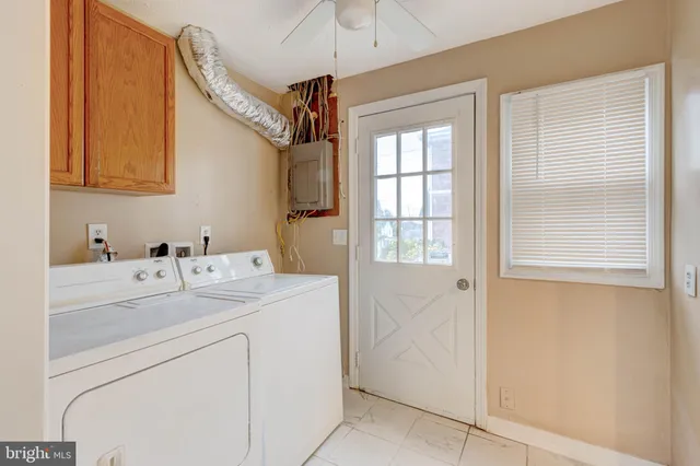 a view of a storage & utility room with a washer dryer