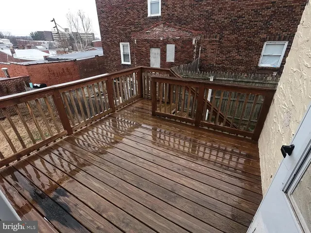 a view of a balcony with wooden floor