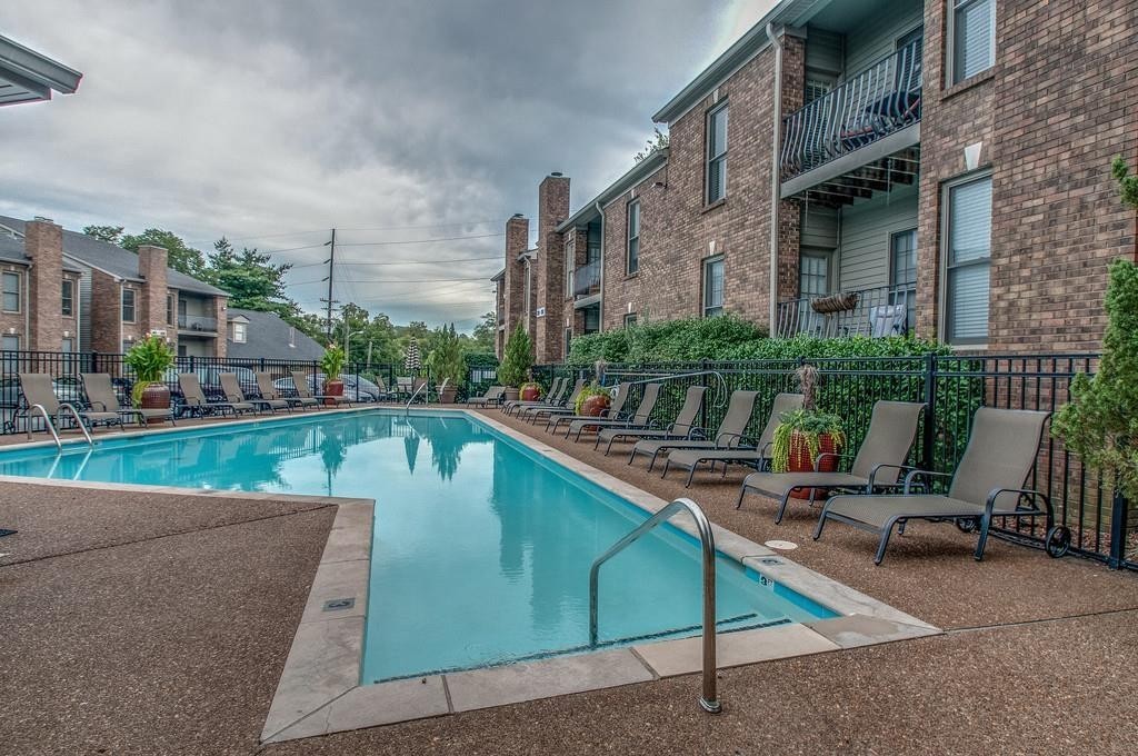 517 Sloan Road Nashville, TN 37209 - Photo 18 of 25 a view of swimming pool with outdoor seating and plants