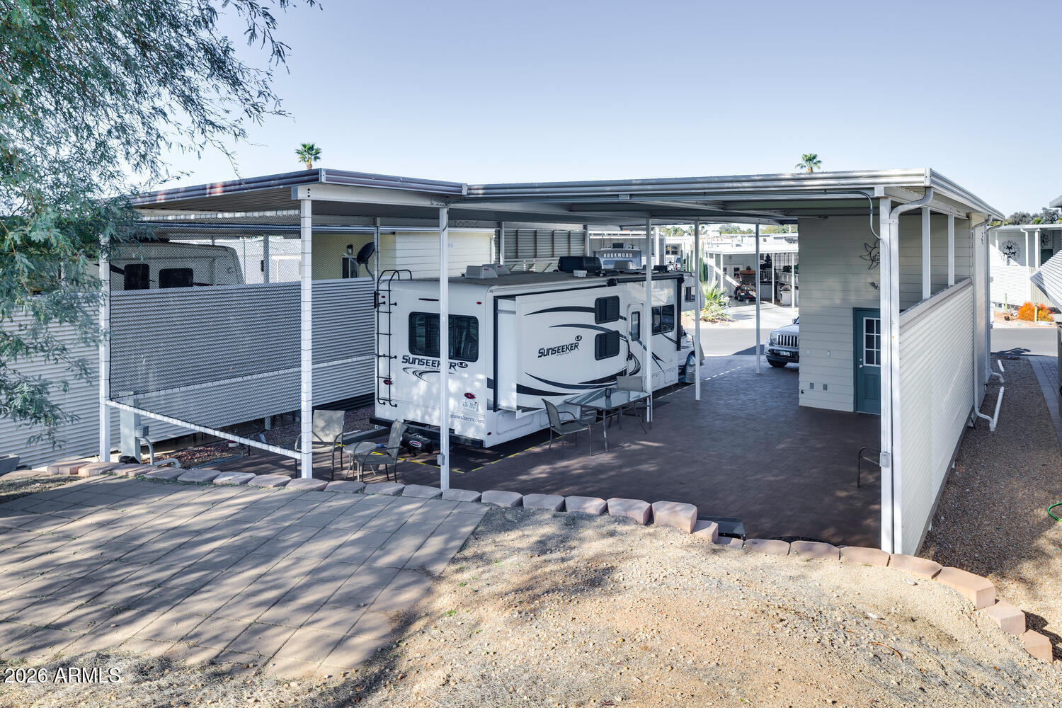 17200 West Bell Road, Unit 722 Surprise, AZ 85374 - Photo 13 of 19 a view of a chairs and table in the patio