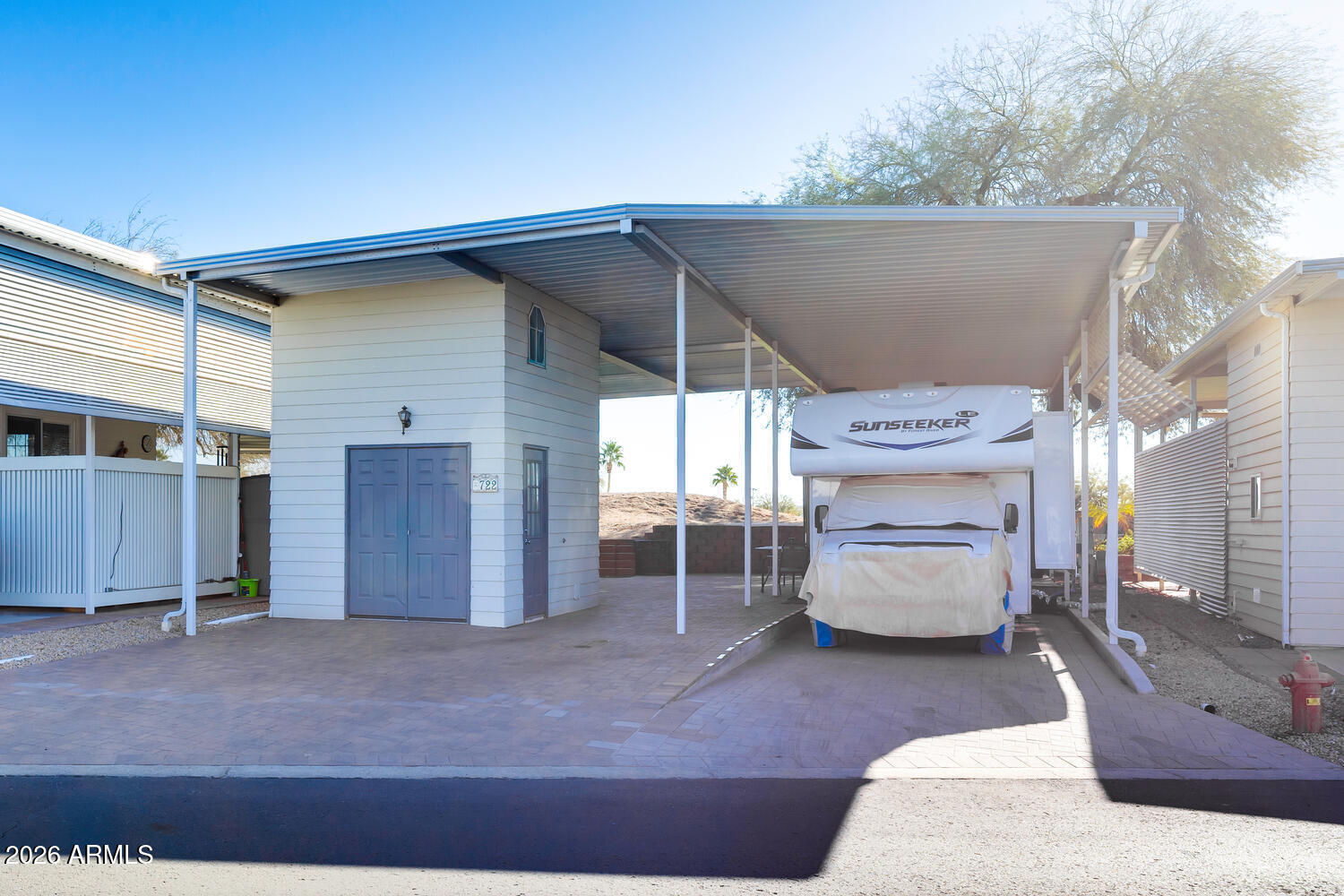 17200 West Bell Road, Unit 722 Surprise, AZ 85374 - Photo 19 of 19 a view of a patio with table and chairs