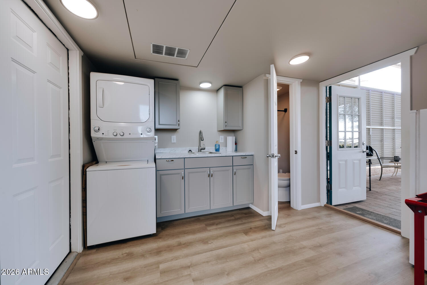 17200 West Bell Road, Unit 722 Surprise, AZ 85374 - Photo 8 of 19 a view of a kitchen with refrigerator and wooden floor