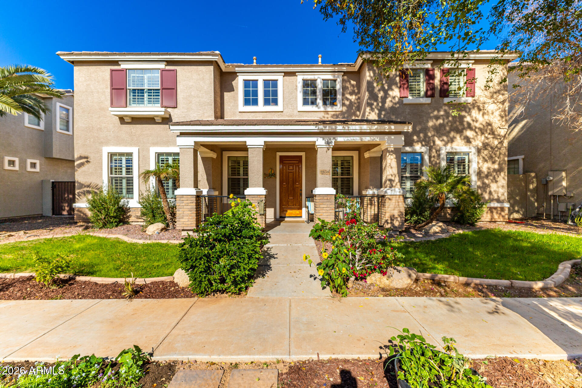 2858 East Shannon Street Gilbert, AZ 85295 - Photo 1 of 35 a front view of a house with garden