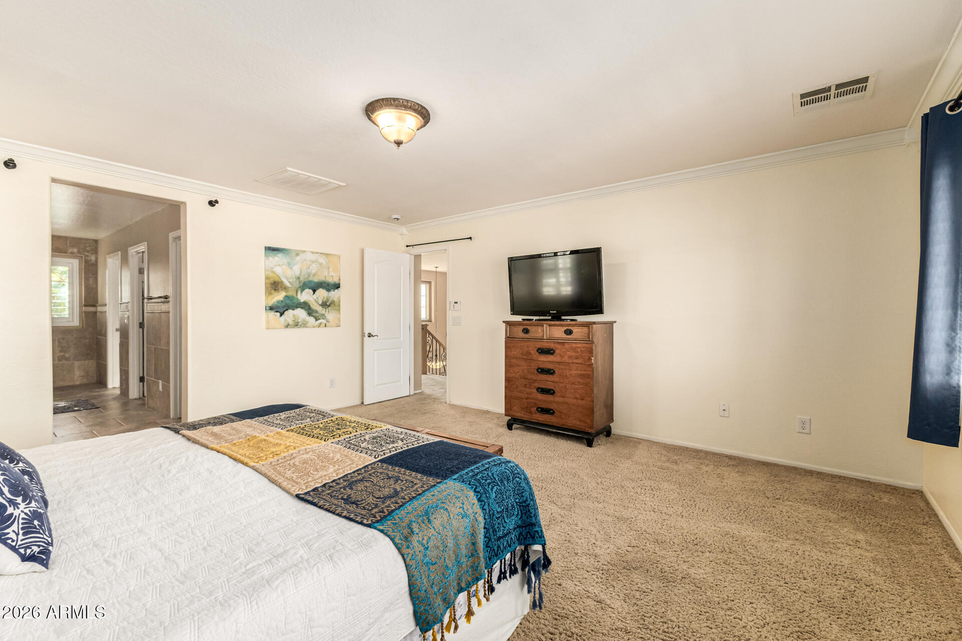 2858 East Shannon Street Gilbert, AZ 85295 - Photo 16 of 35 a bedroom with a bed and a flat screen tv