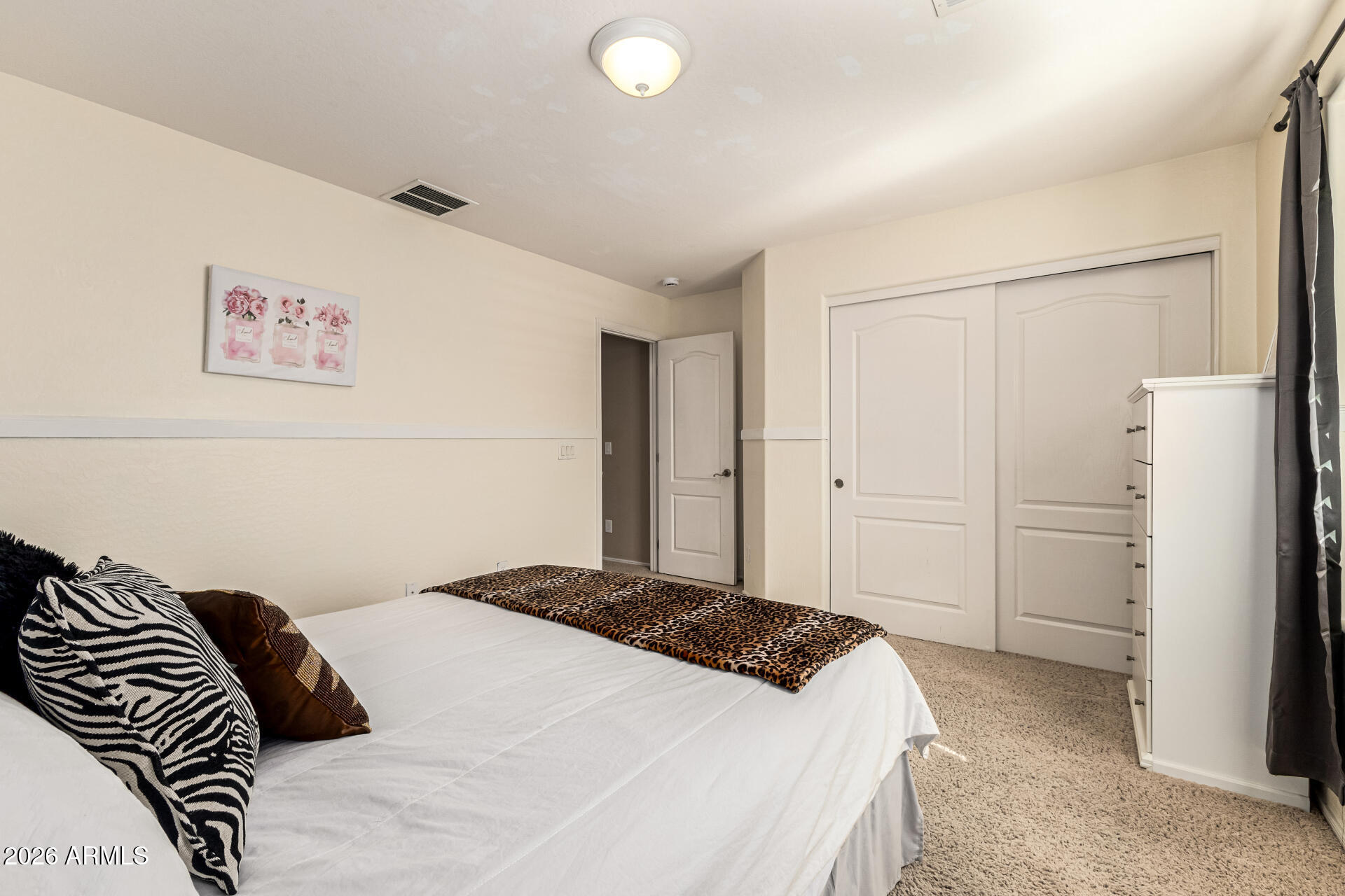 2858 East Shannon Street Gilbert, AZ 85295 - Photo 25 of 35 a bedroom with a bed and a refrigerator