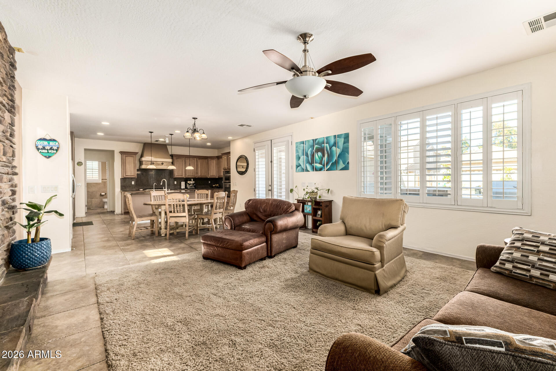 2858 East Shannon Street Gilbert, AZ 85295 - Photo 5 of 35 a living room with furniture and a large window