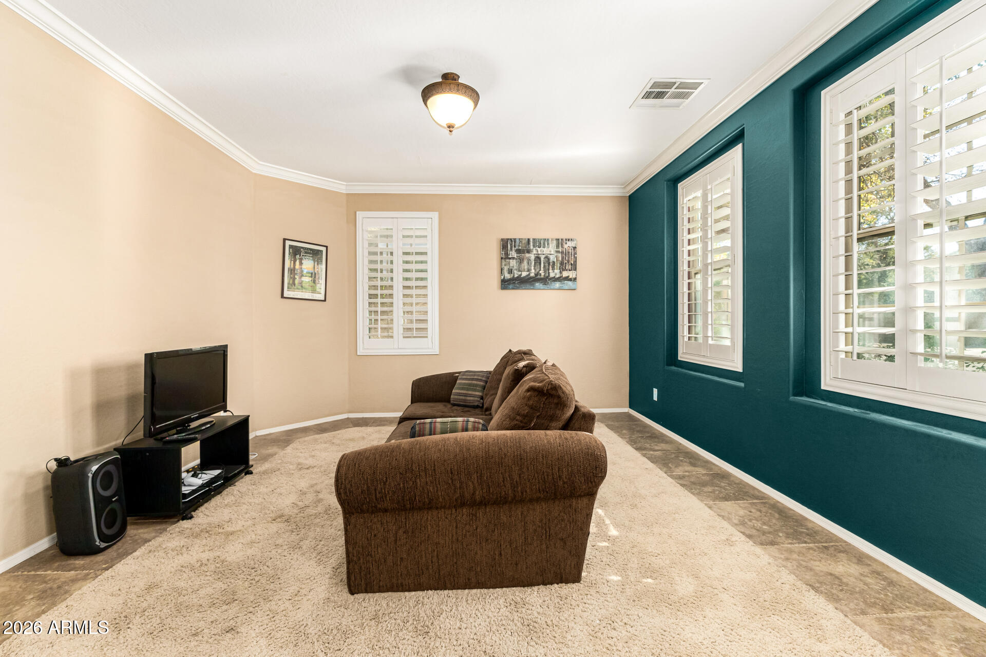 2858 East Shannon Street Gilbert, AZ 85295 - Photo 6 of 35 a living room with furniture and a flat screen tv