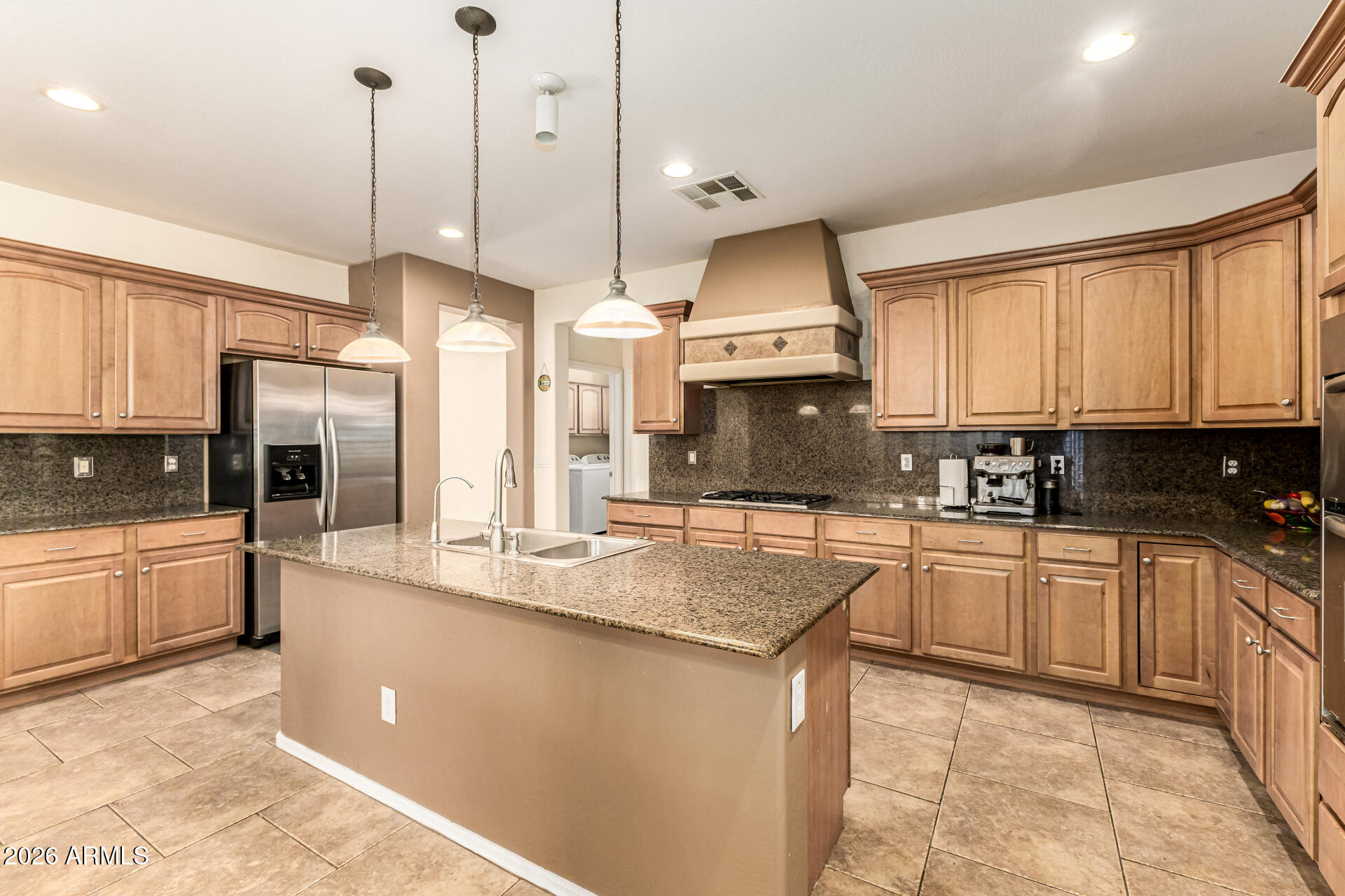 2858 East Shannon Street Gilbert, AZ 85295 - Photo 9 of 35 a kitchen with stainless steel appliances granite countertop a sink a stove and refrigerator