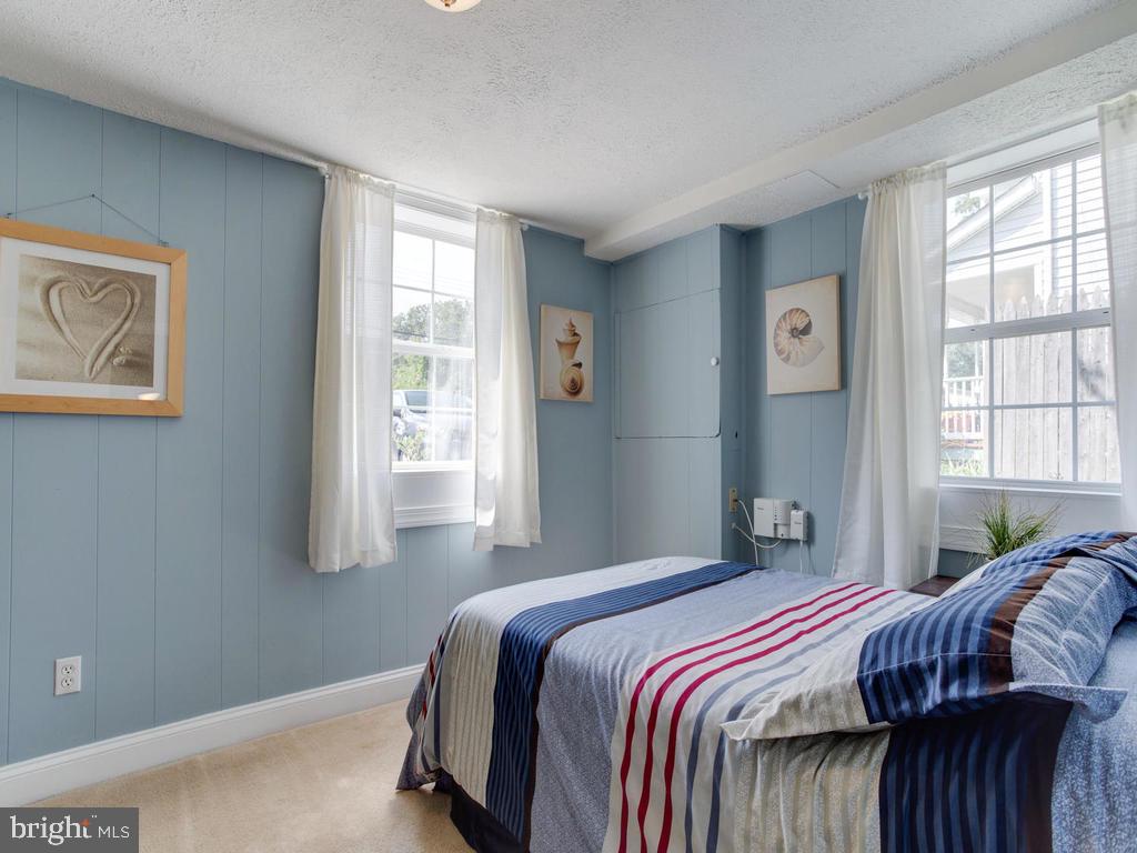 132 Oakwood Road Edgewater, MD 21037 - Photo 23 of 37 a bedroom with a bed and wooden floor