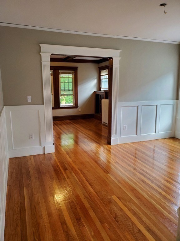 22 Allen Street, Unit 2 Arlington, MA 02474 - Photo 10 of 25 a view of a room with wooden floor and a window