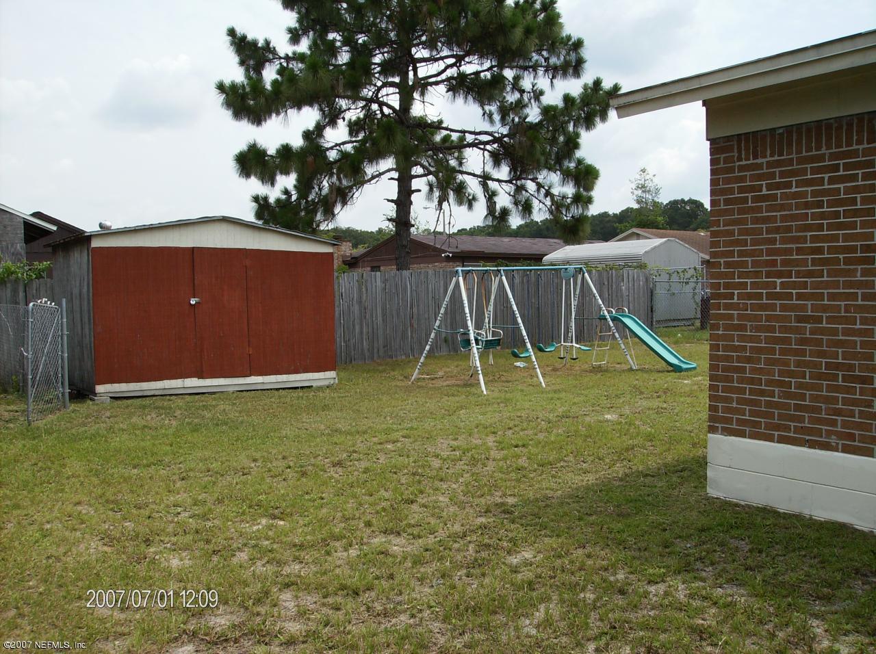 4411 Bedivere Road Jacksonville, FL 32208 - Photo 8 of 12 Shed in back of home