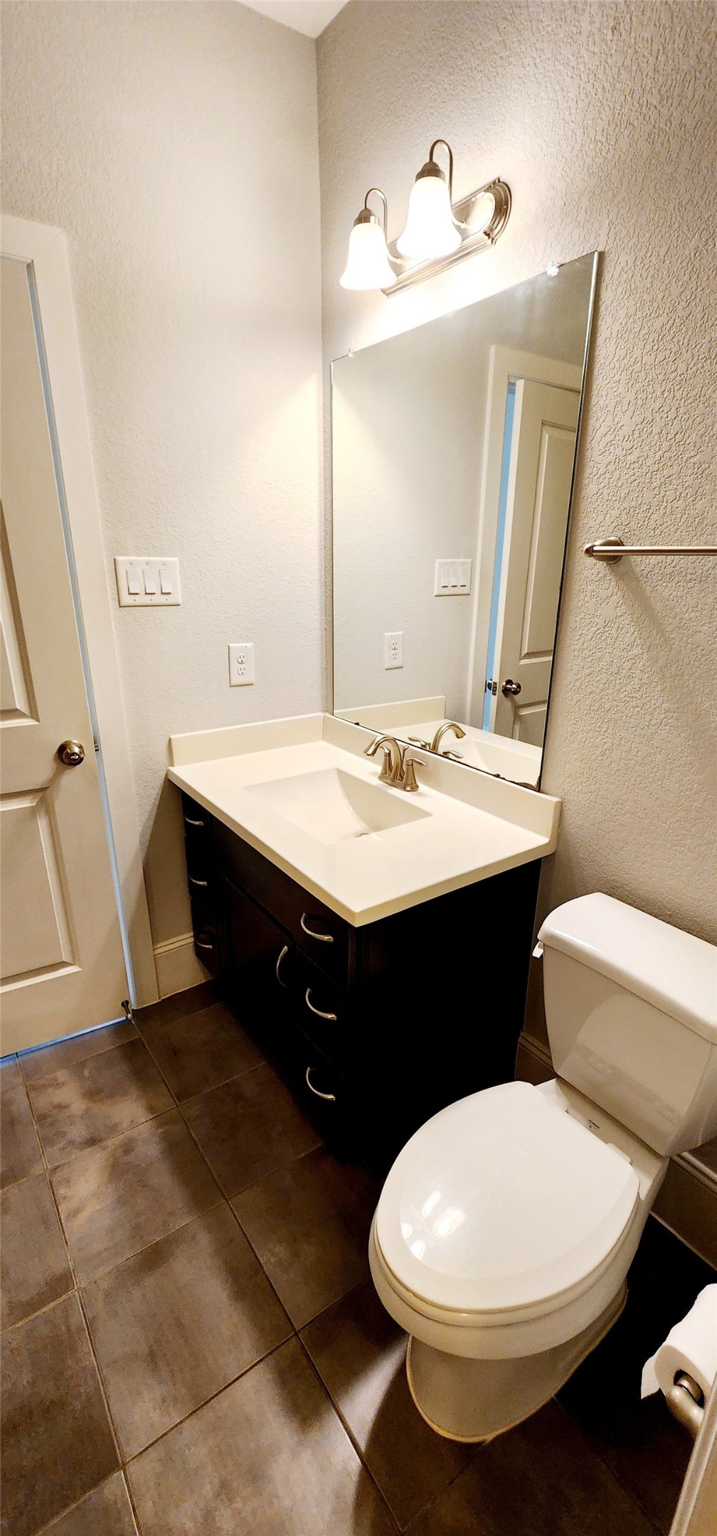 11 West Rafters Row The Woodlands, TX 77380 - Photo 7 of 31 a bathroom with a double vanity sink and a mirror