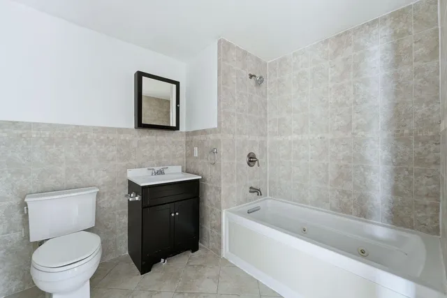 a bathroom with a toilet sink and bathtub