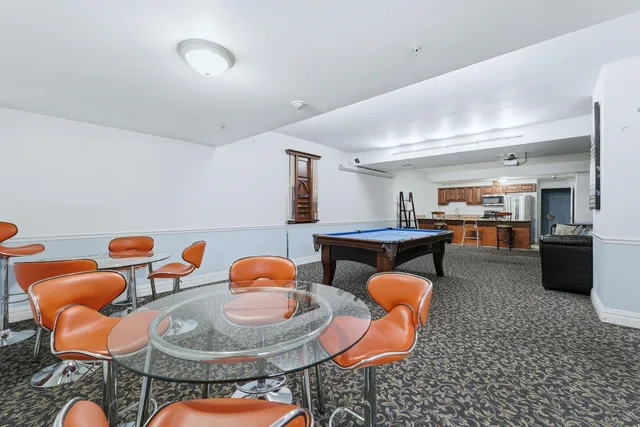 a living room with furniture and a table