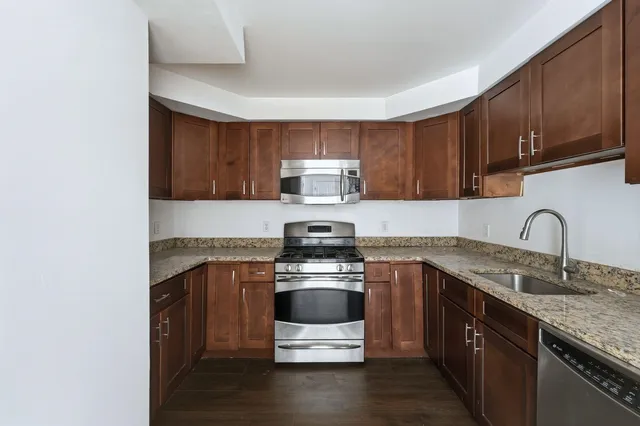 a kitchen with a stove and a sink