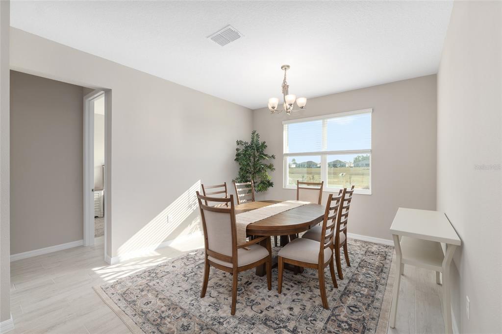 10049 Southwest 107th Lane Ocala, FL 34481 - Photo 29 of 67 a view of a dining room with furniture and window