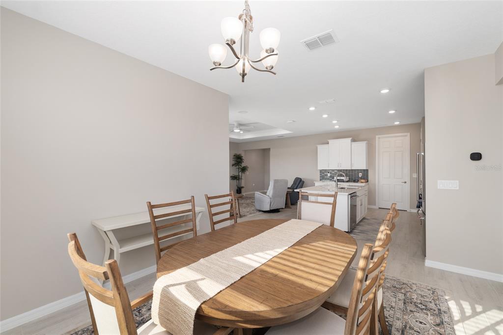 10049 Southwest 107th Lane Ocala, FL 34481 - Photo 31 of 67 a view of a dining room with furniture