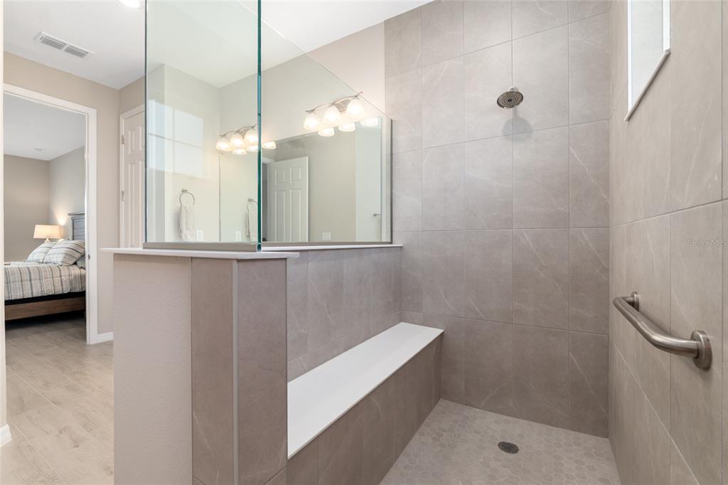 10049 Southwest 107th Lane Ocala, FL 34481 - Photo 39 of 67 a bathroom with a sink a toilet and shower