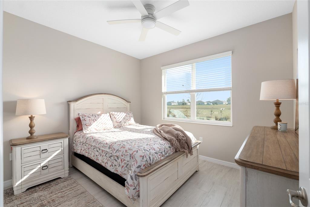 10049 Southwest 107th Lane Ocala, FL 34481 - Photo 41 of 67 a bedroom with a bed and a window