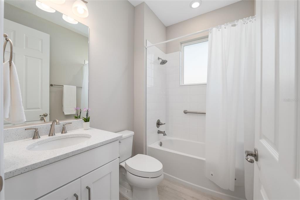 10049 Southwest 107th Lane Ocala, FL 34481 - Photo 45 of 67 a bathroom with a sink toilet and shower