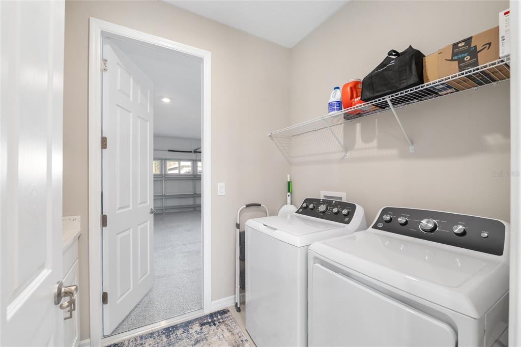 10049 Southwest 107th Lane Ocala, FL 34481 - Photo 46 of 67 a utility room with dryer and washer