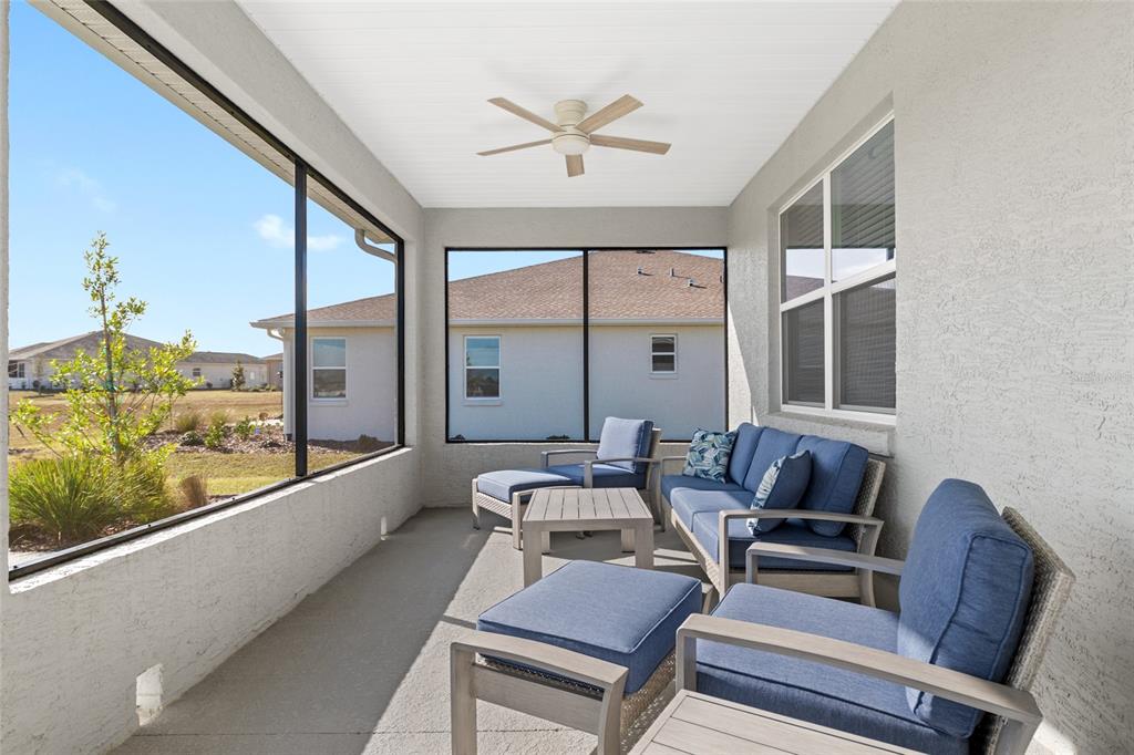 10049 Southwest 107th Lane Ocala, FL 34481 - Photo 54 of 67 a living room with furniture and a large window