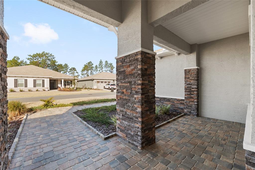 10049 Southwest 107th Lane Ocala, FL 34481 - Photo 10 of 67 a view of house with outdoor space and sitting area