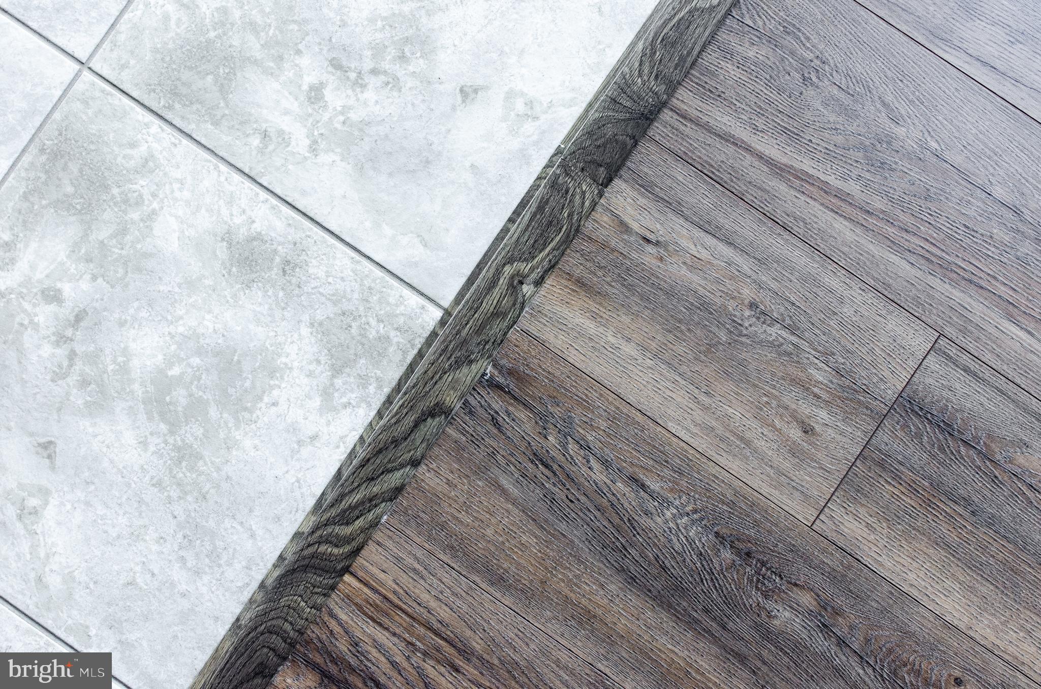 46 Ruddy Duck Lane Bridgeville, DE 19933 - Photo 9 of 47 Transition from Tile to Harkwood in Kitchen to FR