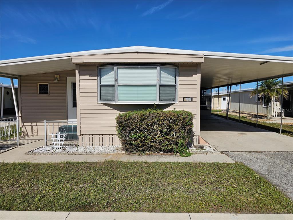 3116 Desoto Road Sebring, FL 33870 - Photo 1 of 1 a front view of a house with garden