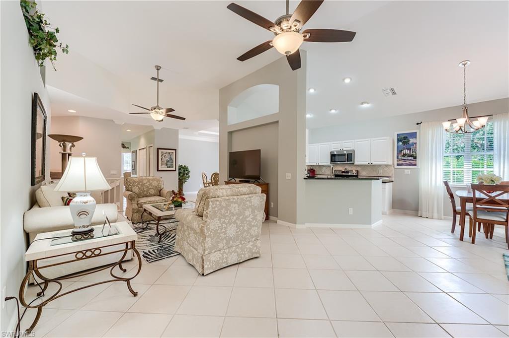23166 Rosedale Drive, Unit 201 Estero, FL 34135 - Photo 2 of 40 a living room with furniture and kitchen view