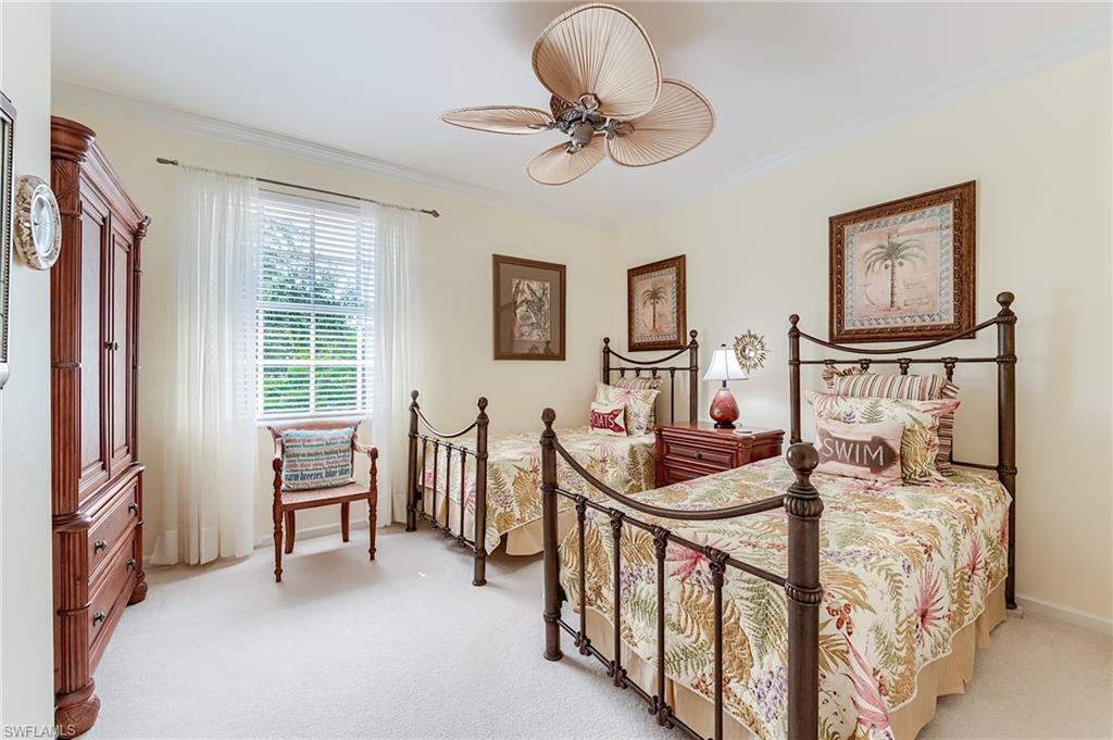 23166 Rosedale Drive, Unit 201 Estero, FL 34135 - Photo 21 of 40 a bedroom with furniture and a window