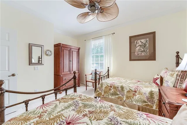 a bedroom with furniture and a window