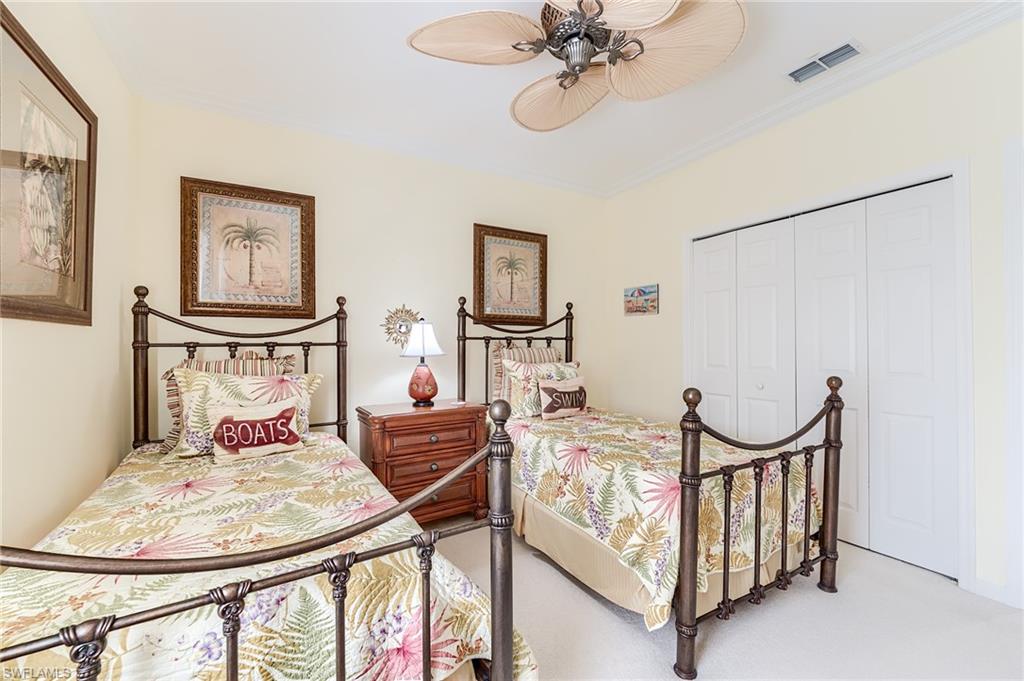 23166 Rosedale Drive, Unit 201 Estero, FL 34135 - Photo 23 of 40 a bedroom with furniture and a window