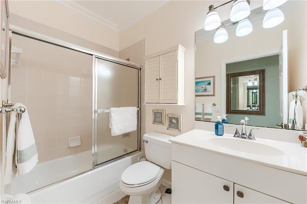 23166 Rosedale Drive, Unit 201 Estero, FL 34135 - Photo 25 of 40 a bathroom with a sink toilet and shower