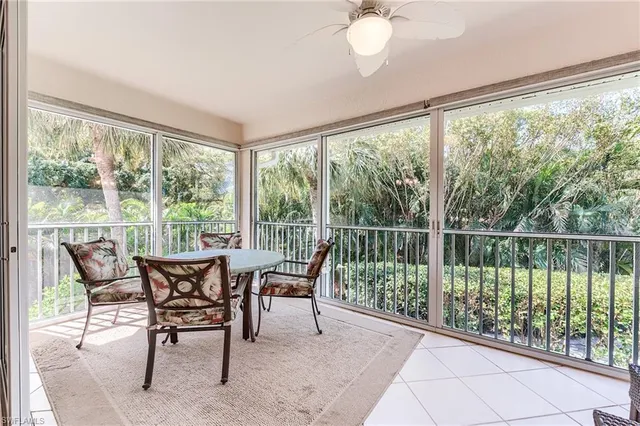 a dining room with furniture and garden view