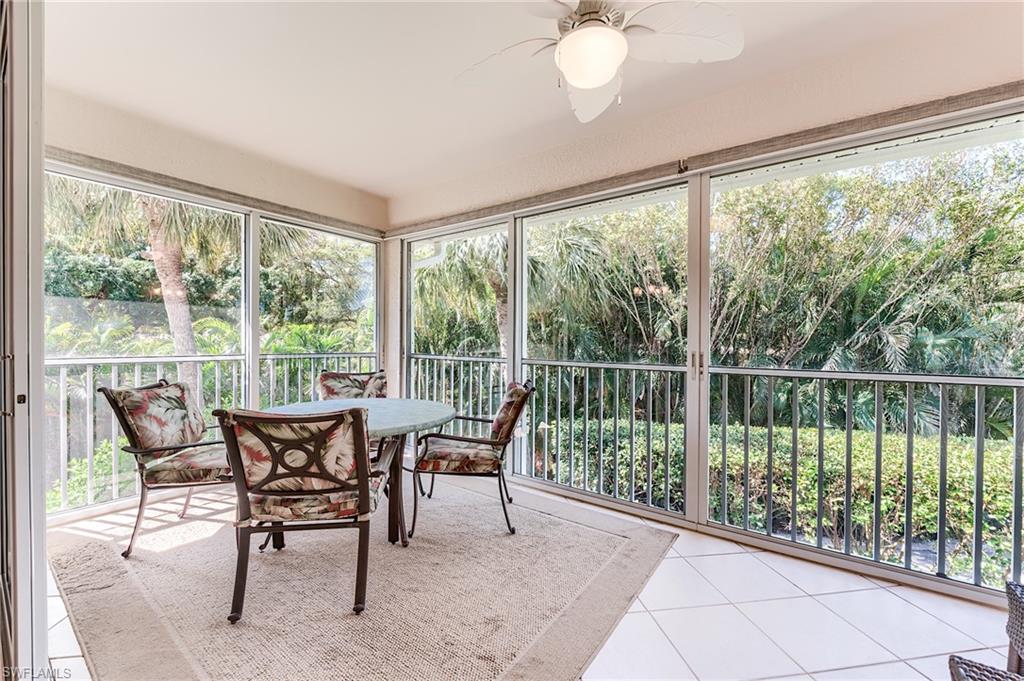 23166 Rosedale Drive, Unit 201 Estero, FL 34135 - Photo 30 of 40 a dining room with furniture and garden view