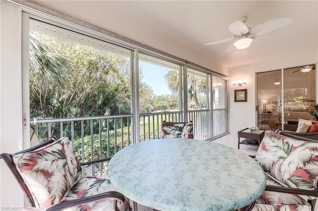 23166 Rosedale Drive, Unit 201 Estero, FL 34135 - Photo 31 of 40 a living room with furniture and a large window with outer view