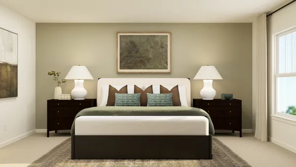 a bedroom with bed and lamp