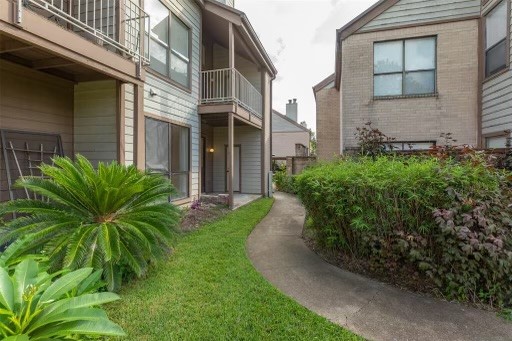 8293 Sands Point Drive, Unit 185 Houston, TX 77036 - Photo 16 of 20 a view of a multi story yard with plants