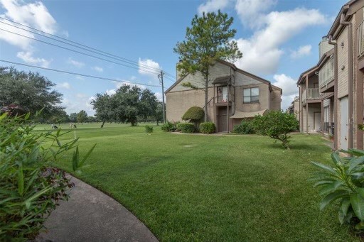 8293 Sands Point Drive, Unit 185 Houston, TX 77036 - Photo 17 of 20 a house view with a garden space