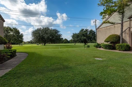 8293 Sands Point Drive, Unit 185 Houston, TX 77036 - Photo 18 of 20 a view of a golf course with a garden