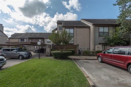 8293 Sands Point Drive, Unit 185 Houston, TX 77036 - Photo 3 of 20 a view of a house with backyard and sitting area
