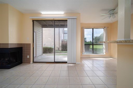 8293 Sands Point Drive, Unit 185 Houston, TX 77036 - Photo 6 of 20 a view of an empty room with a fireplace and a window
