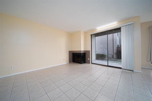8293 Sands Point Drive, Unit 185 Houston, TX 77036 - Photo 7 of 20 an empty room with fireplace
