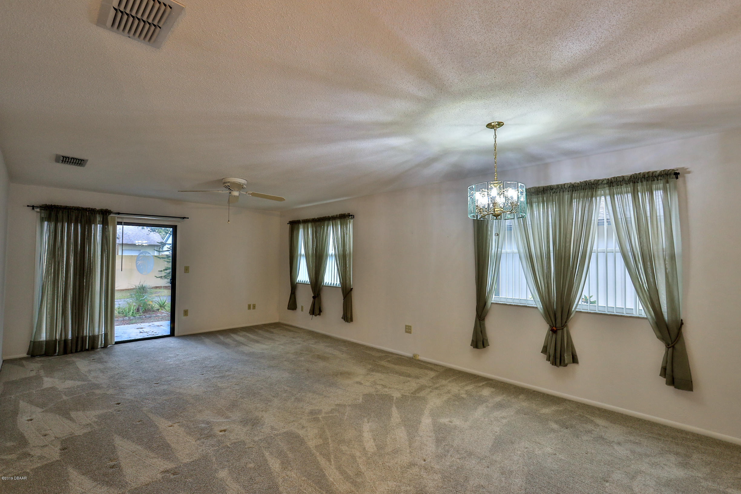 36 Crooked Pine Road Port Orange, FL 32128 - Photo 8 of 27 Great room with sliders to patio