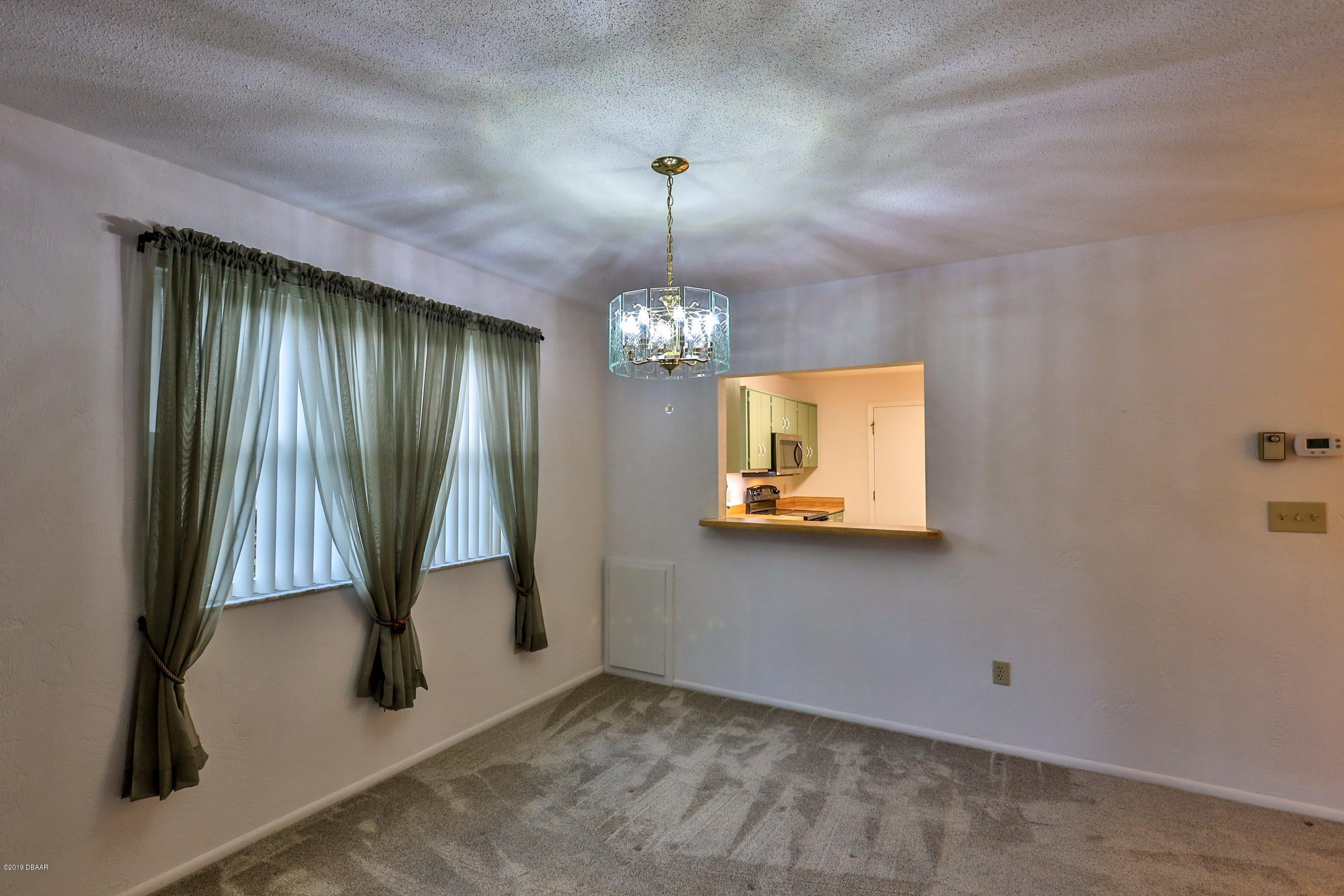 36 Crooked Pine Road Port Orange, FL 32128 - Photo 10 of 27 Dining area pass thru from kitchen